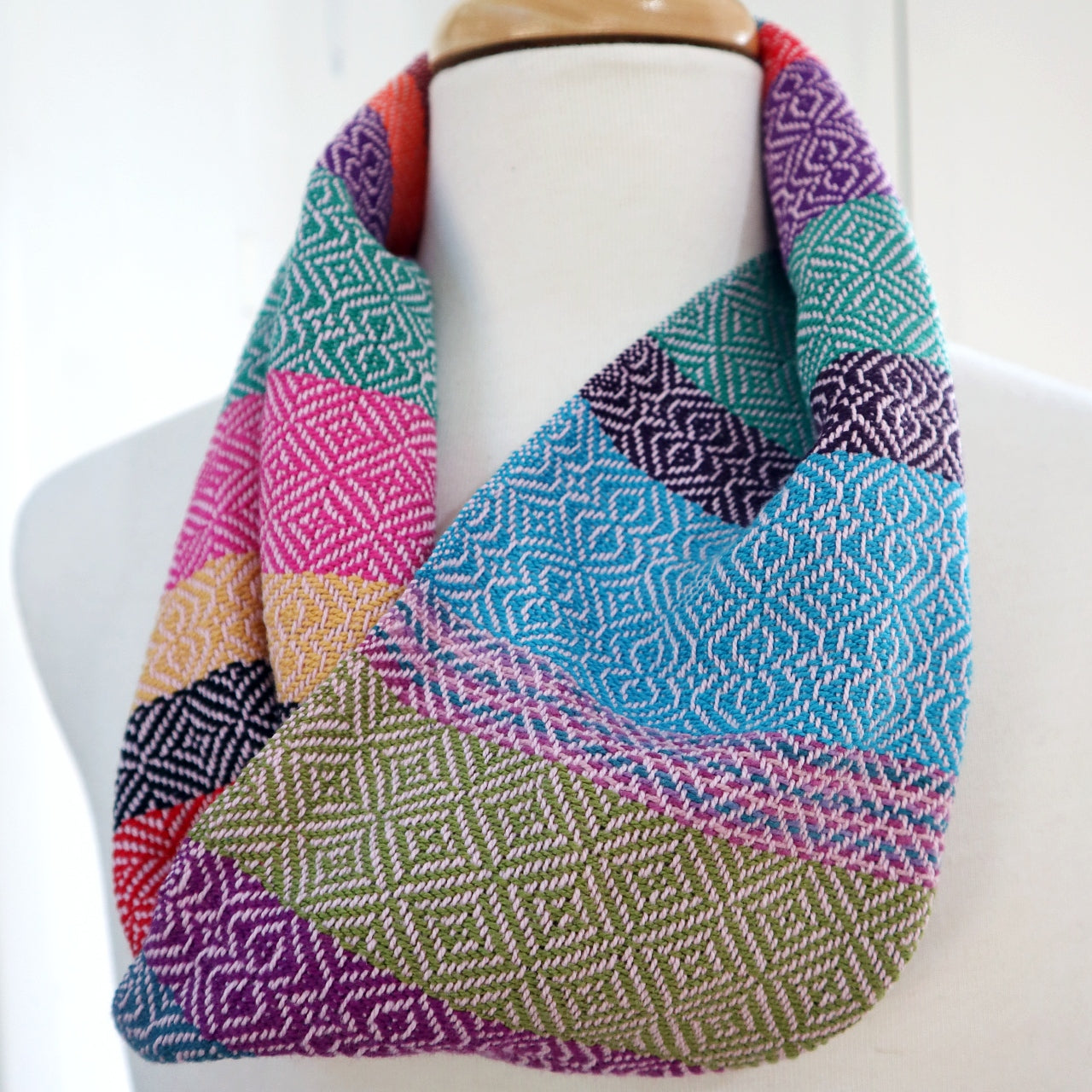 Handwoven cotton scarf in various bright coloured stripes