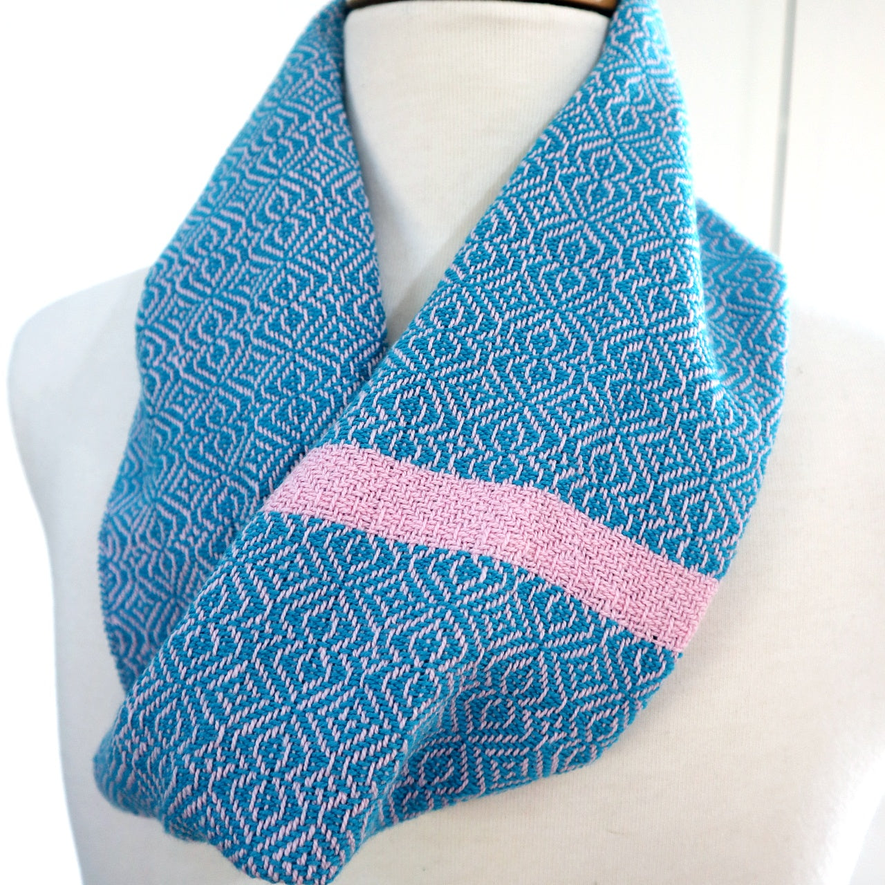 Handwoven cotton scarf in bright turquoise blue with dusty pink