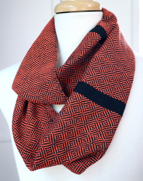 Handwoven cotton scarf in light tangerine orange and black