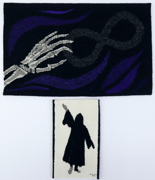 original artwork in hand woven tapestry of a skeleton hand holding an infinity symbol, with a cloaked figure underneath in a separate small tapestry