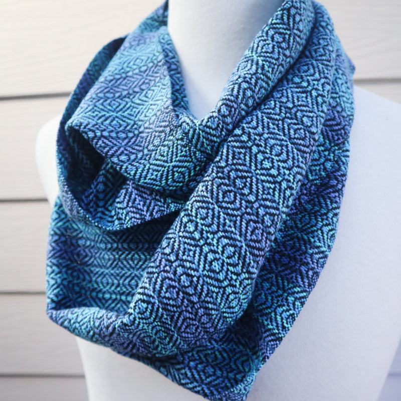 handwoven infinity scarf in blue and green tones